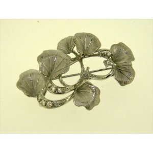 Photo: K18WG DIA BROOCH